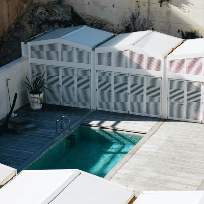 Contemporary villa with a sleek swimming pool and minimalist outdoor design, ideal for luxury retreats.